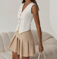 White Buttoned Vest & Pleated Skirt Set.